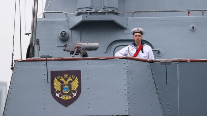 a man in a uniform on a boat